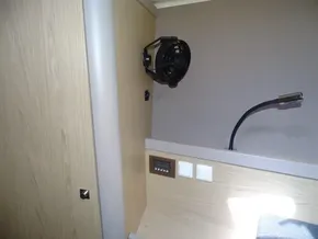 Interior of 2017 Beneteau Oceanis 45 yacht with fan and reading light.