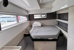 Interior cabin of a 2021 Leopard 50 yacht with a neatly made bed.