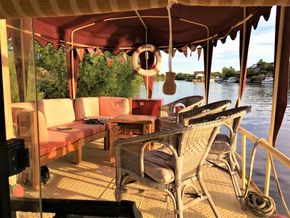 Cozy seating area on a classic 1927 Dutch Barge.