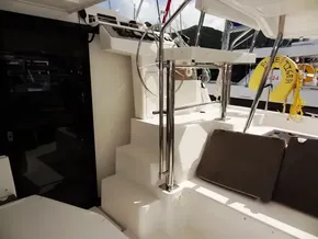 Sleek interior of 2021 Leopard 40 catamaran with modern helm and seating area.