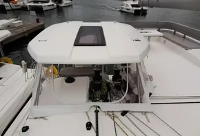 Leopard 50 catamaran 2020 model docked at marina with clear cockpit enclosure.