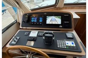Helm of 2025 Linssen 45 SL Sedan with advanced navigation controls and display screens.