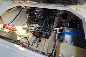 Engine compartment of a 1998 Maxum 2400 SCR boat, featuring a MerCruiser engine.
