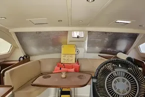 Interior of 2008 Leopard 38 yacht with seating, table, and fan.