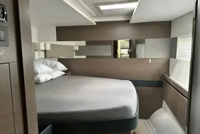 Luxurious bedroom interior of 2022 Leopard 53 Powercat yacht with modern design.