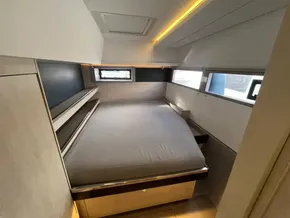 Modern bedroom interior in 2019 Leopard 45 yacht with sleek design and natural lighting.