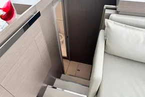 Interior of 2025 Leopard 46 Powercat, featuring stairs and a compact bathroom.