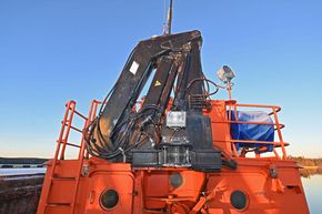 Hydraulic crane on boat deck