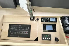 Control panel of 2023 Beneteau Oceanis 51.1 yacht with navigation and audio systems.