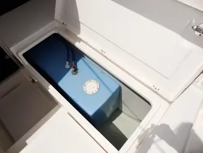 Storage compartment with blue tank on a 2021 Leopard 40 boat.