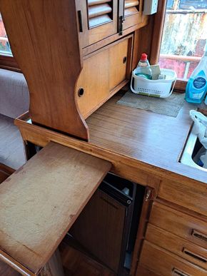 Galley - slide-out chopping board above fridge