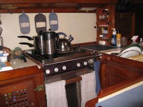 The Galley includes a Force 10 Stove, Refrigeration, double sink, ample cabinets & L countertop cabinet.