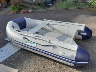 Talmex 2.5M inflatable tender.  Optional Honda 2.3 outboard engine