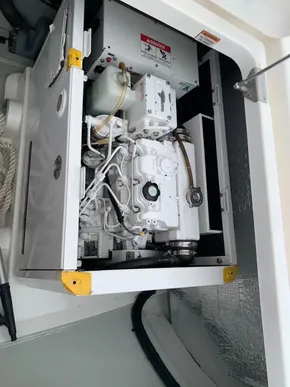 Engine compartment of a 2021 Leopard 45 yacht, showcasing mechanical components.