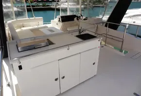 2017 Leopard 43 Powercat yacht interior with helm, seating, and kitchenette.