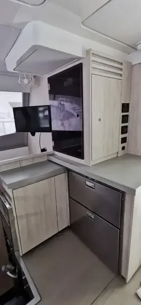 Modern kitchen area in a 2019 Leopard 51 Powercat yacht.