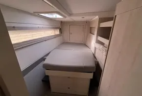 2019 Leopard 51 Powercat cabin interior with bed and storage.