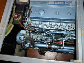 Engine compartment of a 1995 Aquafibre Bounty Boats 10/70, showcasing mechanical components.