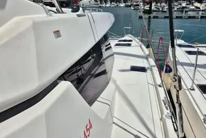 2021 Leopard 45 catamaran docked at marina, showcasing sleek design and spacious deck.