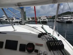 2021 Leopard 40 catamaran docked at marina with other boats in background.
