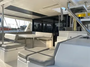 Leopard 45 catamaran 2021 model, featuring spacious outdoor seating and dining area.