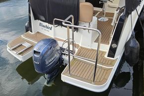 2023 Balt 818 Titanium boat with Yamaha 50 engine, docked on water.
