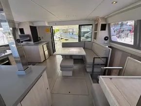 Interior of a 2019 Leopard 40 catamaran with modern kitchen and seating area.