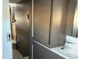 Modern bathroom interior on a 2022 Leopard 42 yacht, featuring sleek wood cabinetry.