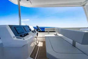 2025 Leopard 40 Powercat cockpit with modern controls and seating, overlooking the ocean.
