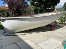 Yacht tender with sail, oars, trolley