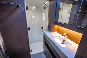 Modern bathroom in 2025 Leopard 46 yacht with sleek design and ambient lighting.