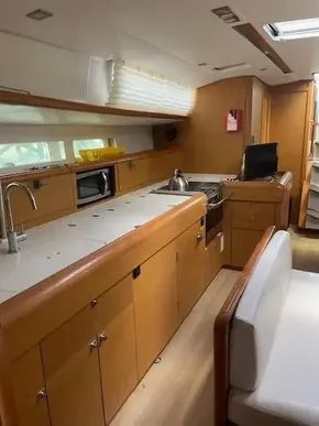 2017 Jeanneau Sun Odyssey 519 yacht interior kitchen with modern amenities.