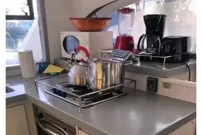 Modern kitchen in a 2020 Leopard 40 yacht with stove, oven, and appliances.