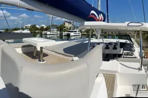 Luxurious 2022 Leopard 45 yacht with spacious deck and marina view.