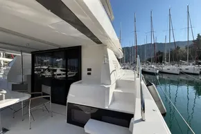2024 Leopard 40 Powercat yacht docked in marina, showcasing sleek design and spacious deck.