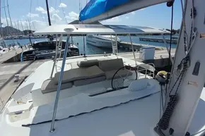 2020 Lagoon 46 catamaran docked at marina, featuring spacious deck and seating area.