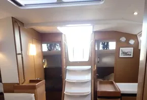 Interior of 2019 Jeanneau Sun Odyssey 440 sailboat, featuring modern wood finish and spacious layout.