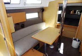 Interior of 2017 Beneteau Oceanis 38 sailboat with dining area and seating.