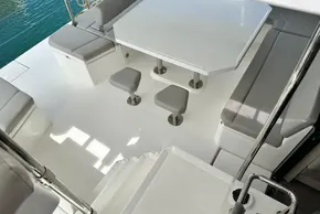 Luxurious Leopard 50 yacht interior with modern seating and table, 2021 model.