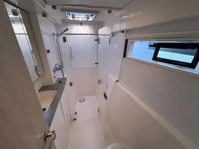 Modern bathroom interior of 2019 Leopard 40 yacht with shower and window.