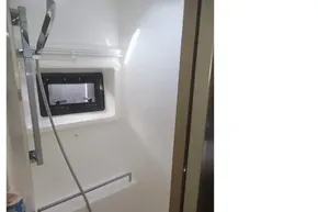 Modern shower area in 2022 Leopard 45 yacht with sleek fixtures and window.