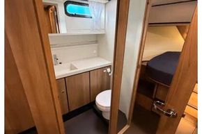 Interior of 2025 Linssen 45 SL Sedan yacht, featuring a modern bathroom and cozy cabin.