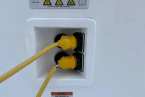Yellow power cables connected to a 2024 Leopard 40 Powercat outlet.