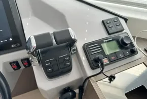 Control panel of 2025 Robertson and Caine Leopard 46 Powercat with throttle and navigation system.