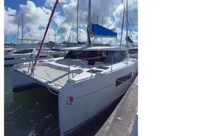 2018 Leopard 45 catamaran docked under a bright blue sky.