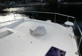 2018 Leopard 43 Powercat boat deck with railing and covered equipment.