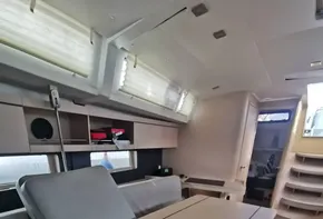Interior of 2020 Beneteau Oceanis 46.1 yacht with modern seating and dining area.