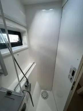 Compact shower area in a 2019 Leopard 45 yacht with modern fixtures.