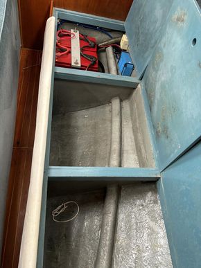 Battery charger and batteries under saloon seating