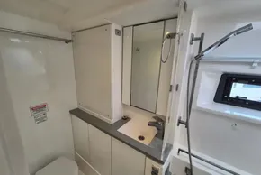 Modern bathroom in a 2020 Leopard 45 yacht, featuring sleek fixtures and ample storage.